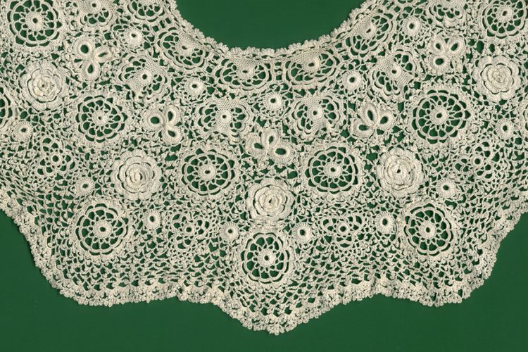 white Irish lace crochet on a green background Queen Victoria crochet