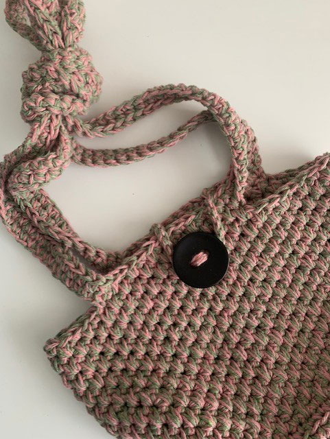 flat lay photo of the Diana bag with knotted straps 