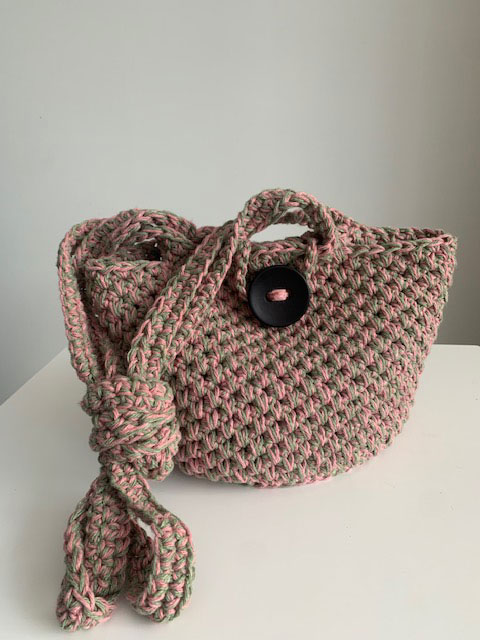 photo of the Diana bag sitting upright and with straps knotted Diana bag crochet pattern 