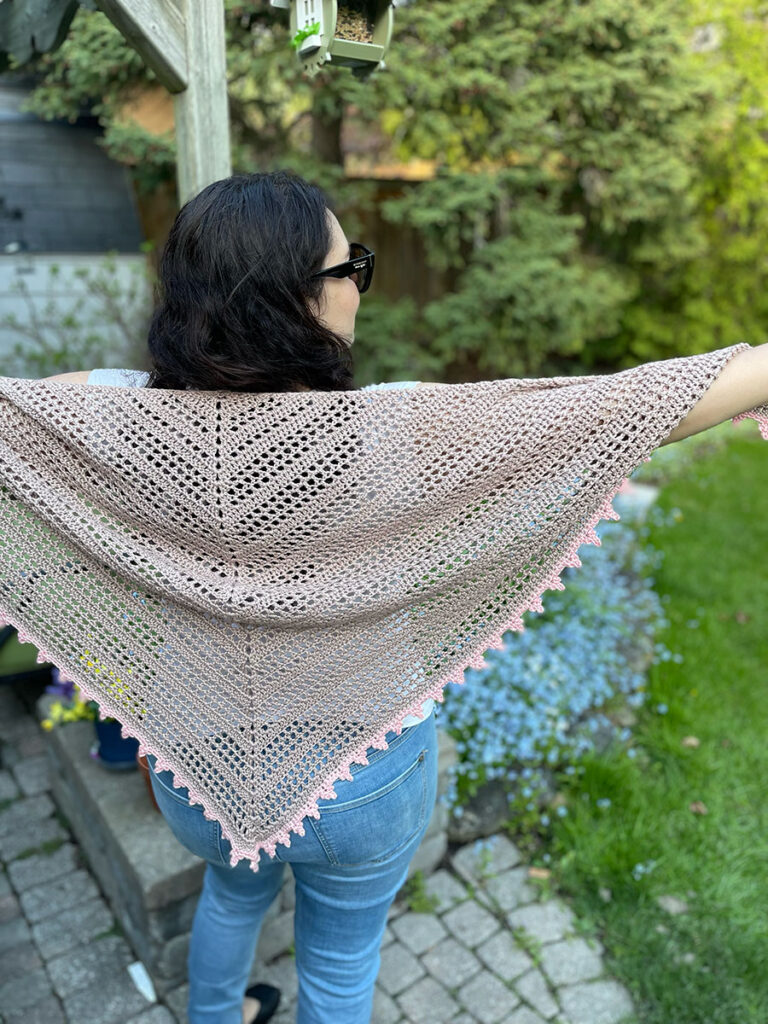 Sweet Dreams shawl on a model, displaying wingspan 