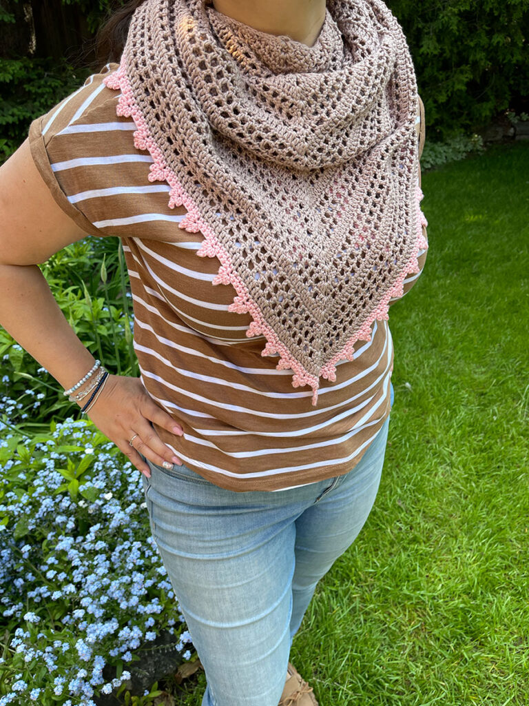 Sweet Dreams shawl on a model, wrapped around the neck and upper torso 