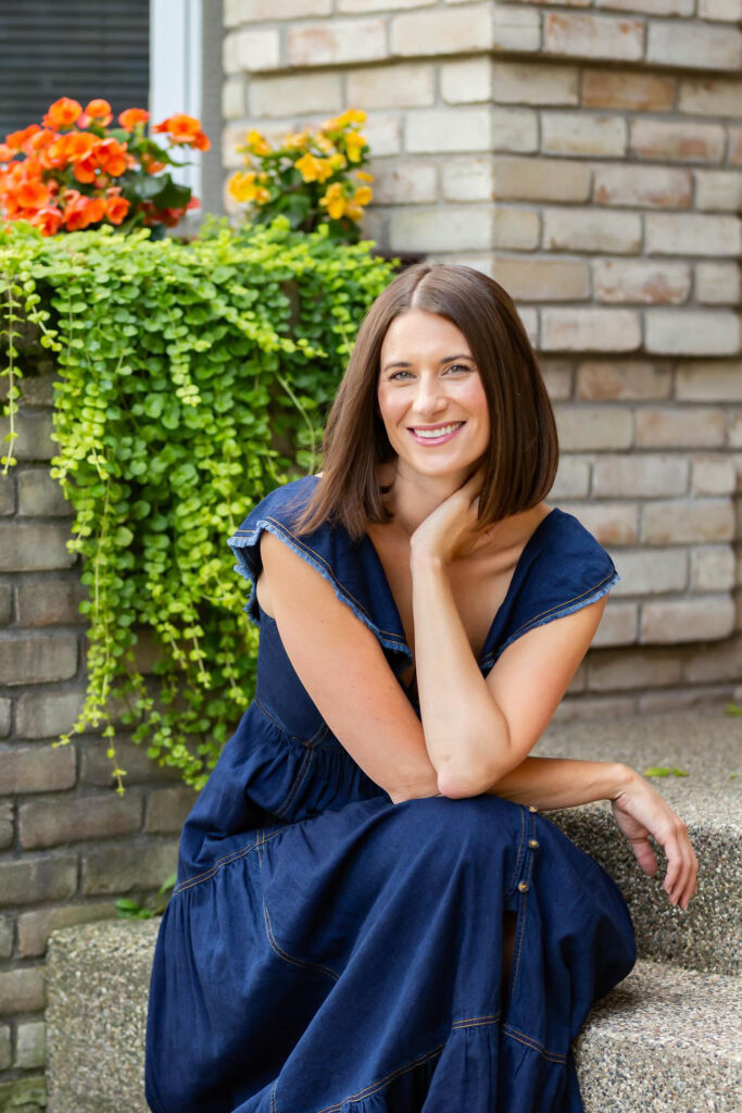 photo of the designer in a blue dress 