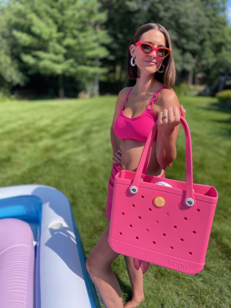 picture of the designer holding a bog bag with her spinner accessory 